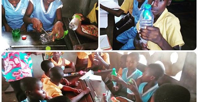 students in ghana creating bottle-balloon models of lungs